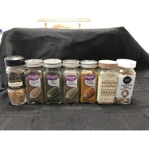 Lot Of 9 Glass Spice Jars With Expired Spices Still In Them.